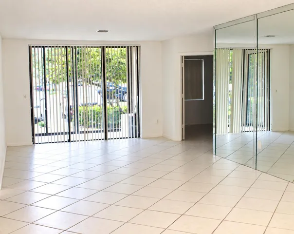 Bright Empty Living Room with Mirrored W