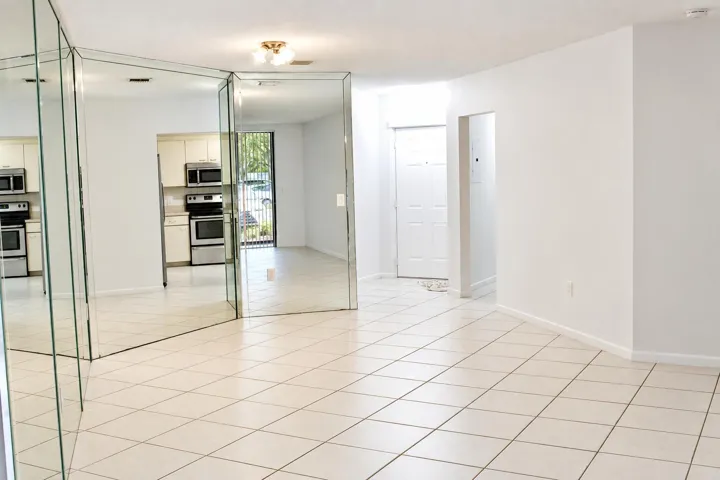 Bright Mirrored Foyer and Kitchen View
