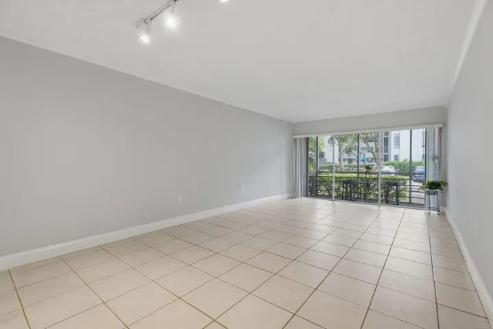 Large living area leading to screened patio