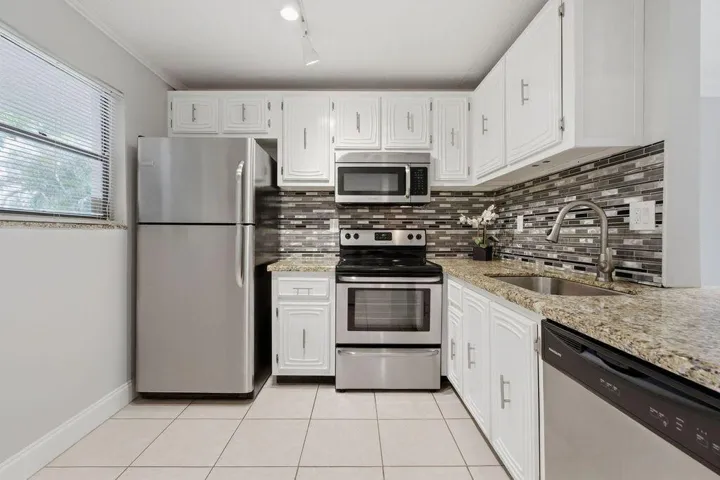 Stainless appliances including dishwasher granite counters