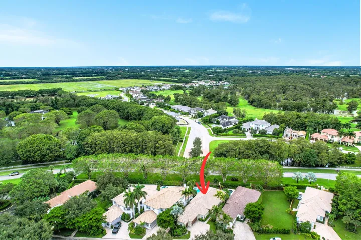 Aerial perspective showcasing residential properties and surrounding green spaces