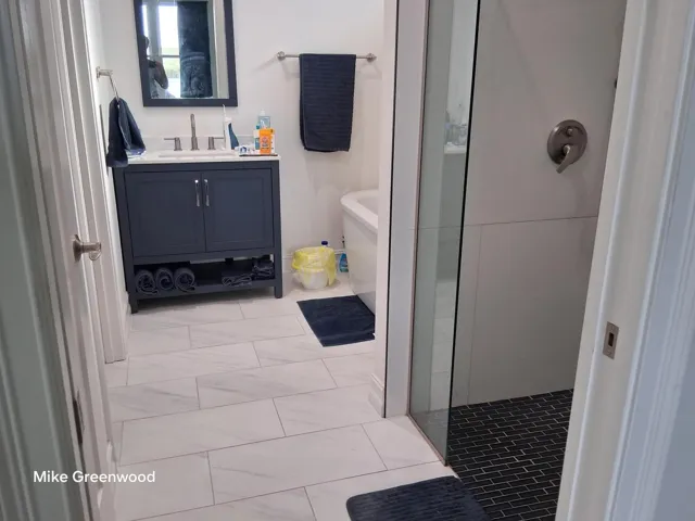 master bath with walk in shower and 58 gallon soaker tub
