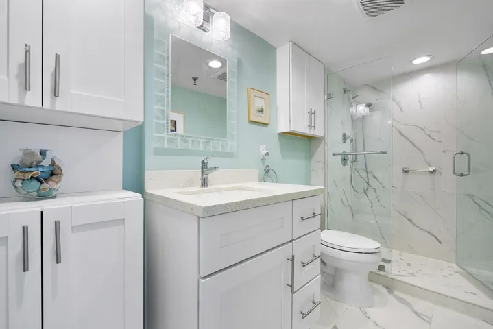 Updated with walk-in glass enclosed shower