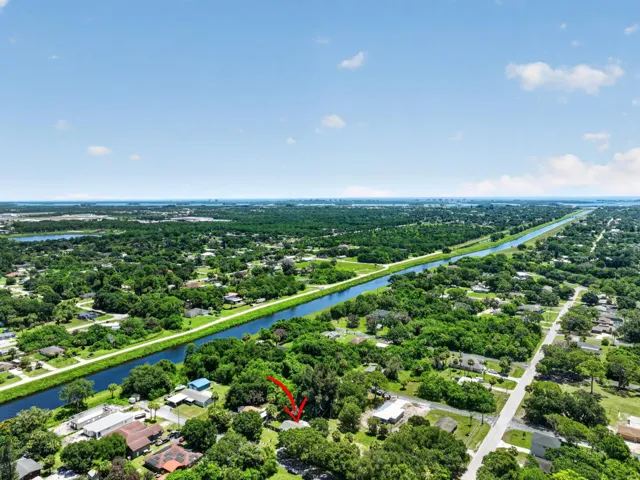 Aerial perspective showcasing a residential area bordered by a canal