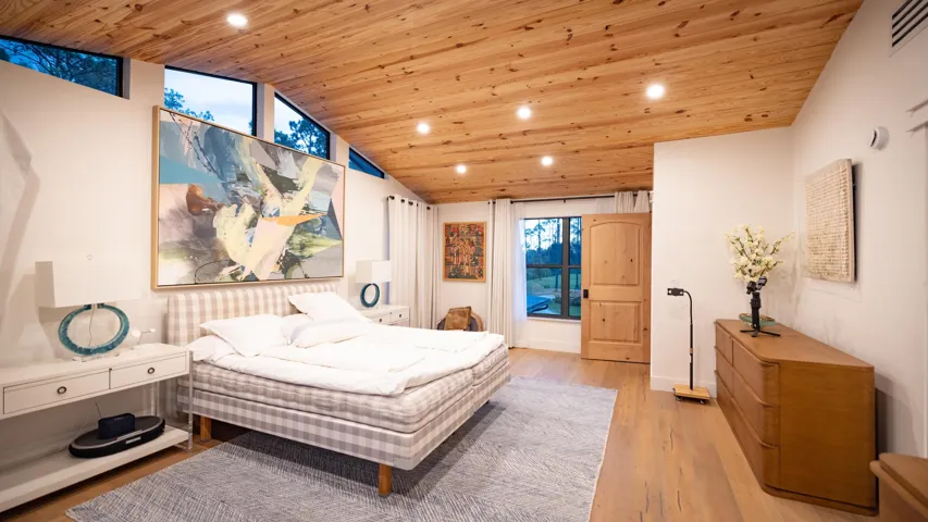 Vaulted wood-finish ceiling with recessed lighting