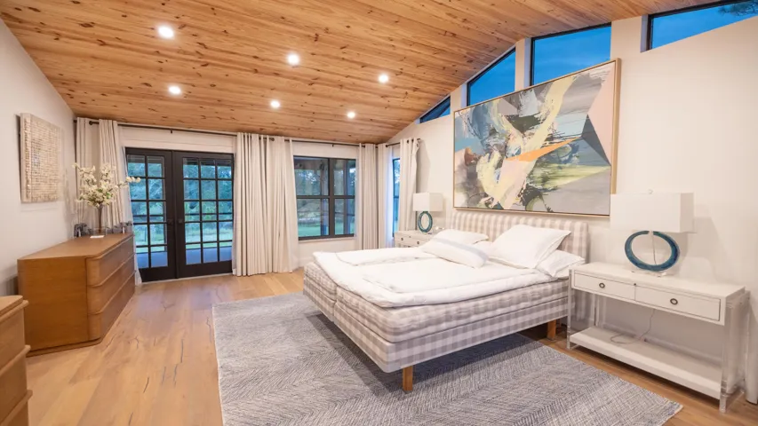 Vaulted wood-finish ceiling with recessed lighting