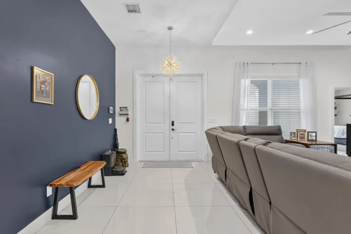 entryway with modern chandellier