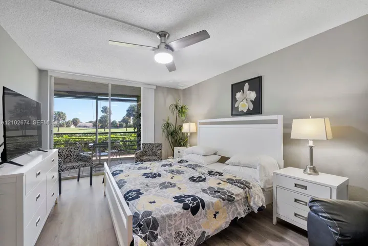 Primary bedroom with a golf course view