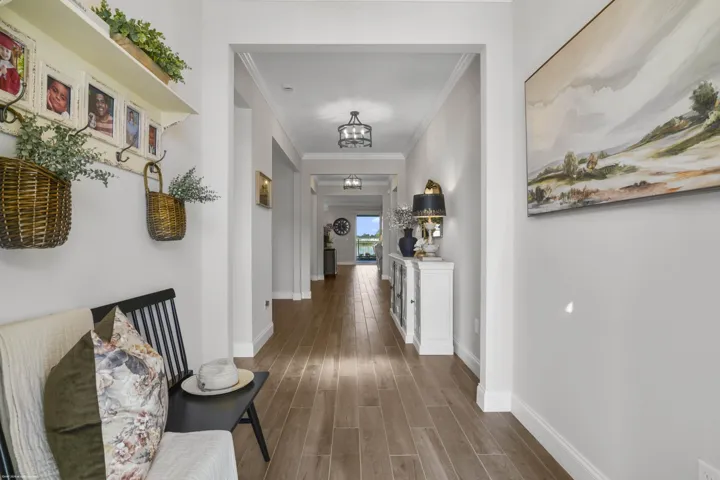 Gallery hallway with wood-look plank flooring