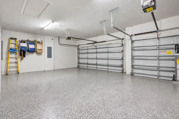 Three-car garage with epoxy-style floor