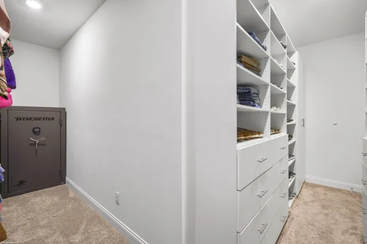 Bedroom closet with custom built-in shelving