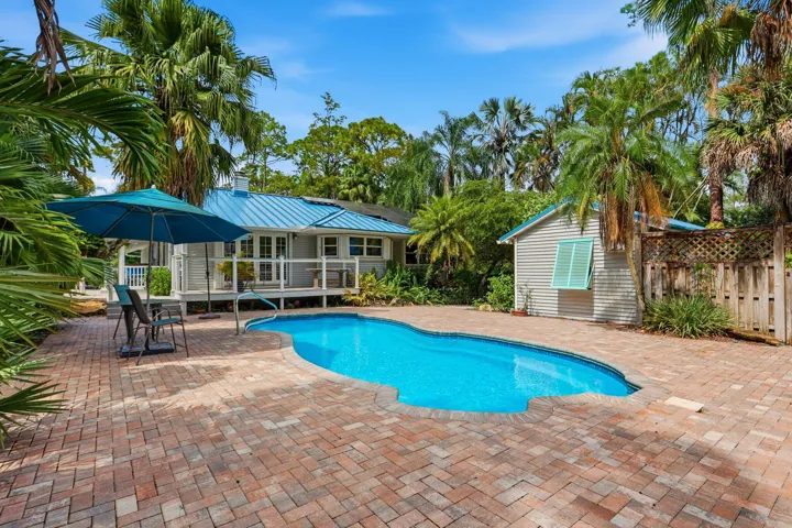 View of the house and the office/flex structure by the pool