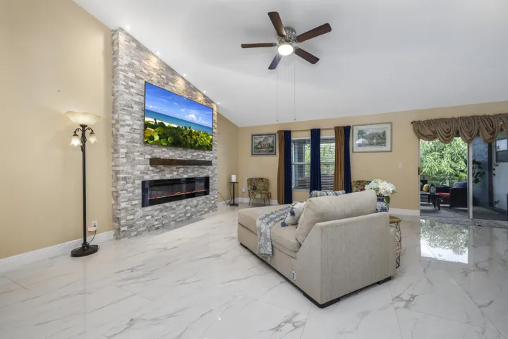 Living Room with Custom Decorative Stone Fire Wall