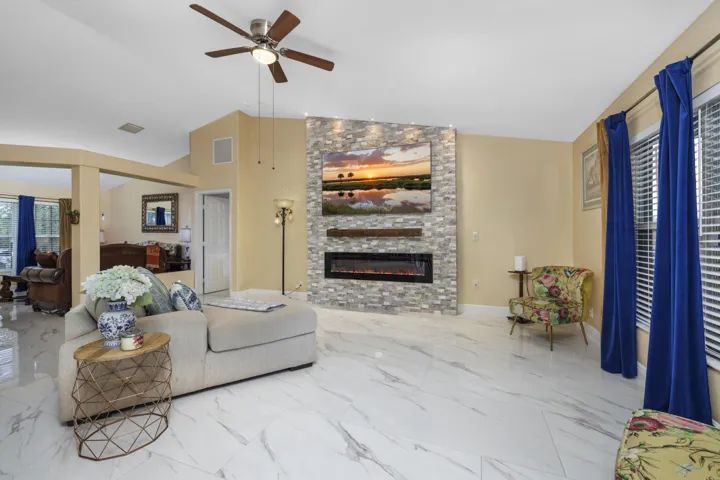 Living Room with Custom Decorative Stone Fire Wall