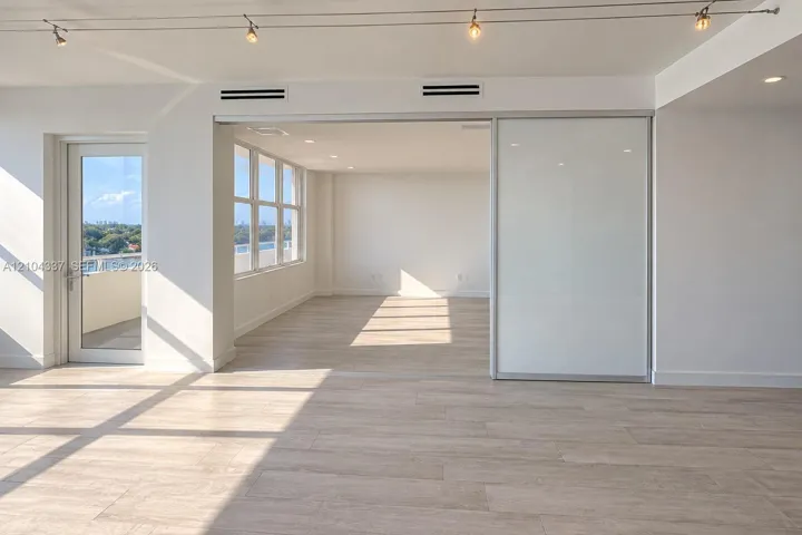 Versatile Den / Guest Suite — Virtually staged to illustrate two possible uses of the space: a private home office or guest bedroom. Floor-to-ceiling sliding glass panels allow for an open or enclosed layout.