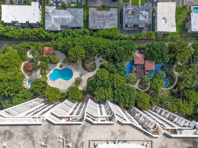 Experience the breathtaking south side aerial view! Marvel at the stunning waterfalls on the left, while the inviting barbecue area awaits on the right. Don't miss out on the expansive third-floor pool area—perfect for relaxation and recreation!