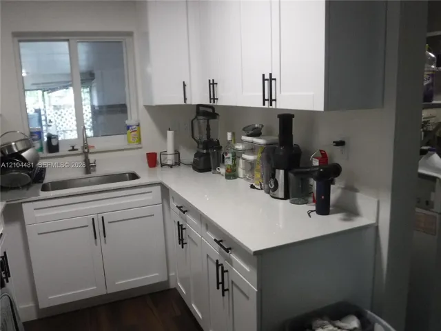 Quartz Countertops and Shaker Kitchen Cabinets