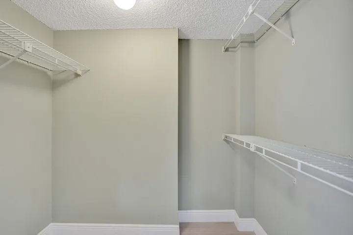 Extra Large Walk-in Closet locate din the Bedroom