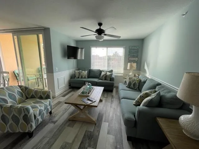 lots of natural light- dining/living area opens up to a covered patio that overlooks the clubhouse & Lakes Fountain. 2 pull out couches-coastal furnished- Impact windows & sliding doors, 2nd floor unit
