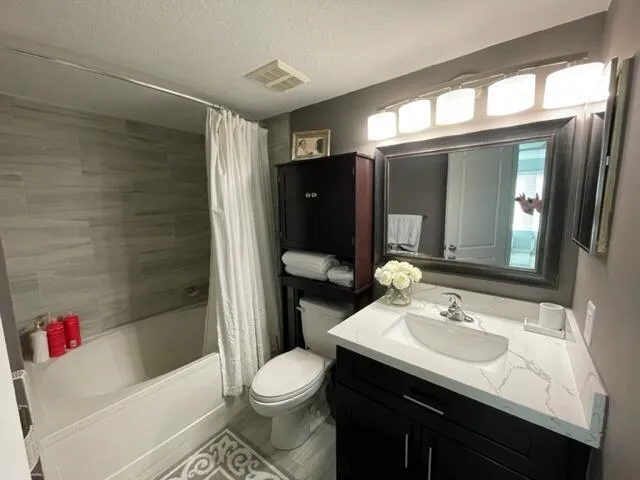 master bedroom has a large roman tub and bathroom had vanity and lighting update