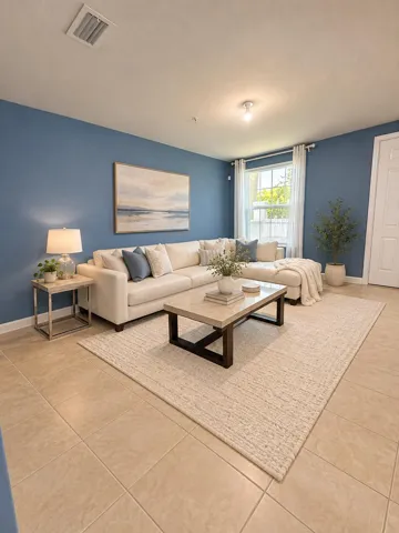 Elegantly staged blue-walled living room