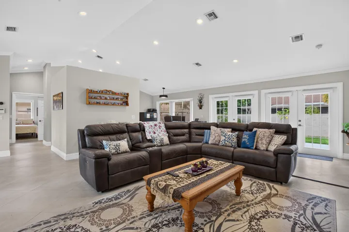 Recessed lighting, light-toned walls, and wood-finish flooring