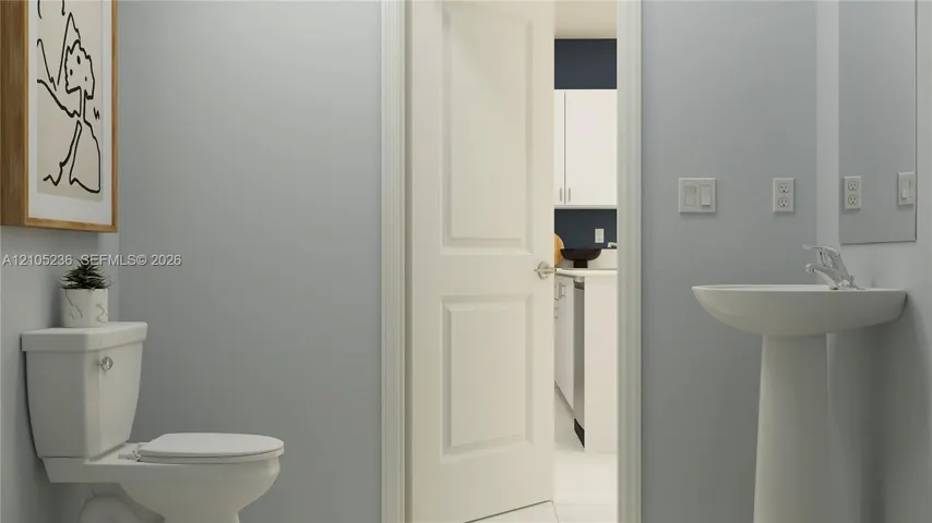 The powder room is tucked away off the living area for convenient access at any time of day.