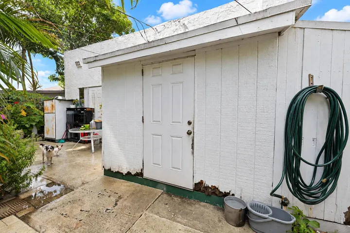 81 sq ft utility room is attached to the back of the house. Access door inside the house is off the back of the kitchen.