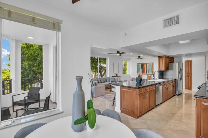 Two seating areas, dining and kitchen.