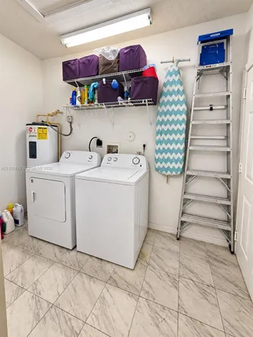 Tile flooring with a light-toned finish, wall-mounted shelving, and a water heater