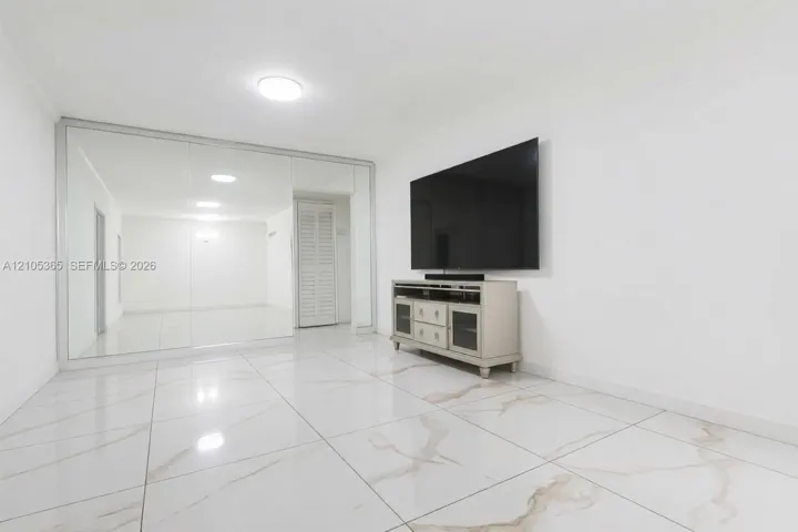 White walls with full-height mirrored panels