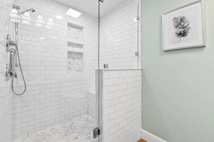 With custom shower and enclosure