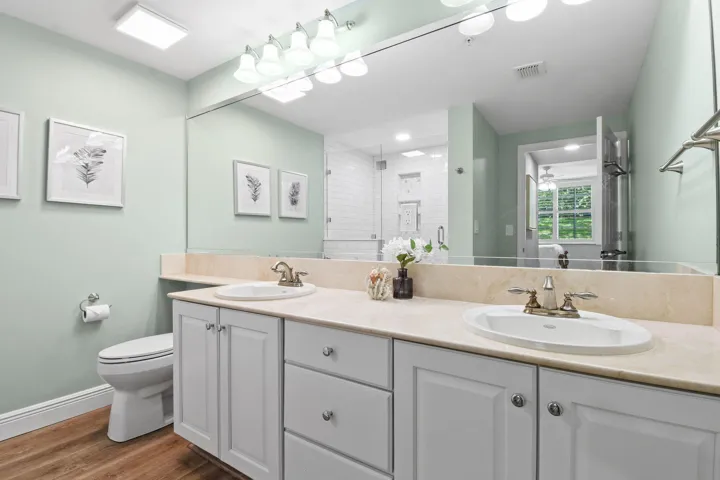 With double vanity and new cabinets and fixtures
