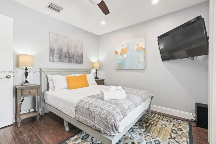 Wood-finish flooring, recessed lighting, and a ceiling fan