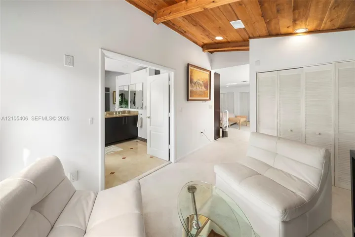 Wood-finish plank ceiling with recessed lighting