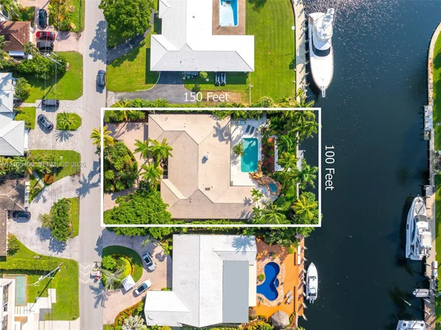 Waterfront property with private boat dockage, a swimming pool, and an integrated spa