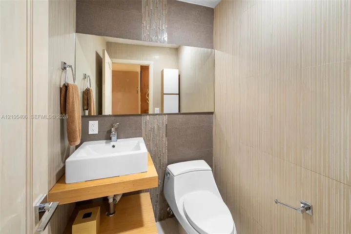 Wall-mounted vanity with a rectangular vessel sink, complete with a modern faucet