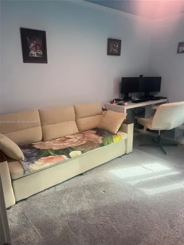 Light blue wall paint and light gray carpeting