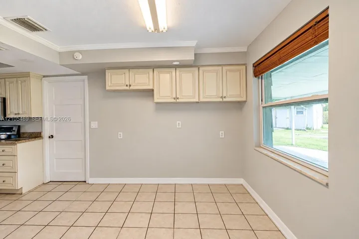 Tile flooring complemented by light-toned wall paint