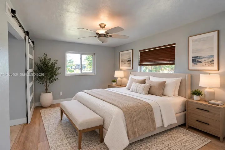 Virtual Staging Wood-finish flooring, a ceiling fan, a barn door, and a window with blinds