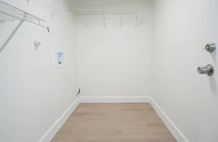Large room in garage, enough space for full size washer and dryer and additional storage.