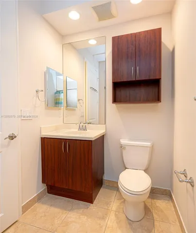 Wood-finish vanity with an integrated sink and countertop