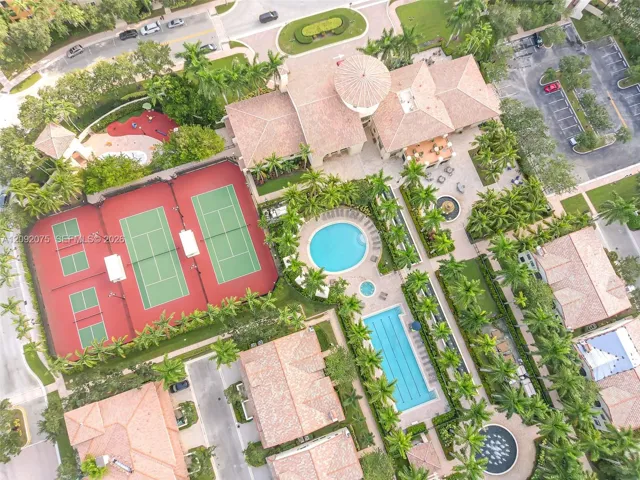 Community featuring two tennis courts, two swimming pools, a central fountain, and extensive landscaping