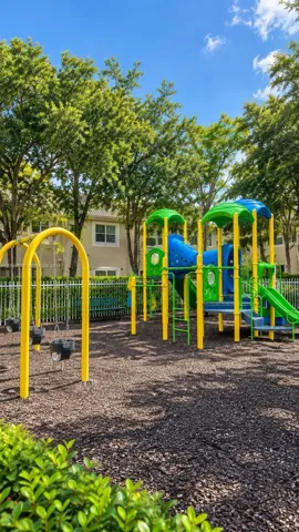 Community playground featuring swings, slides, and climbing structures
