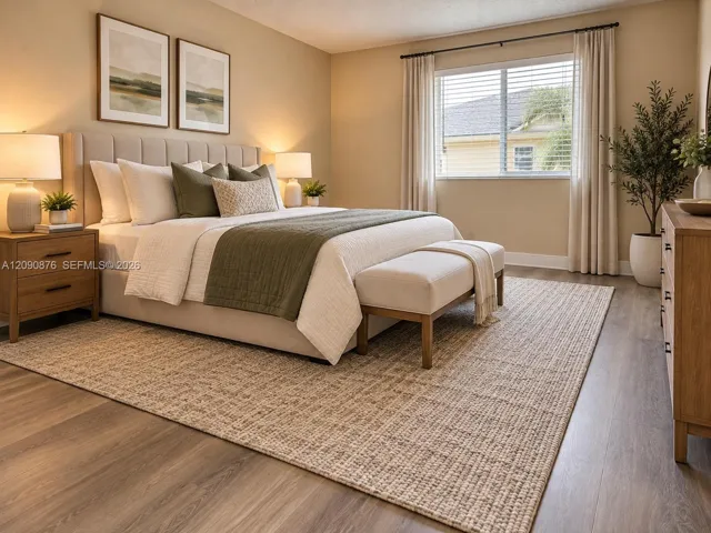 Laminate wood-finish flooring, neutral wall tones, and a window with blinds and drapes