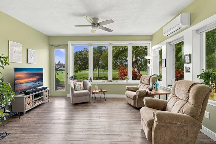 Enjoy your enclosed sunroom year-round. Windows are screened to let in fresh air if desired.