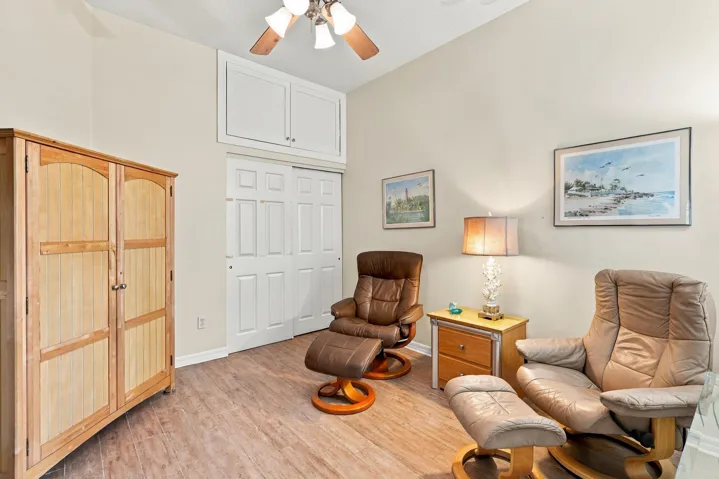 Bedroom in front of home. Extra storage areas have been added above several closets. Great place to store those less-used items.