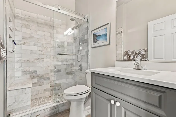 Guest bath has been upated to include a tiled walk-in shower.