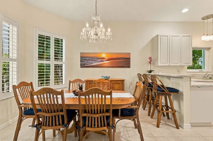 Separate dining room is adjacent to the kitchen. Notice the Waterford crystal chandelier (included in sale).