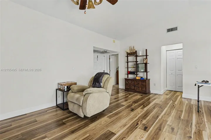 Vaulted ceilings, wood-finish flooring, and multi-panel interior doors